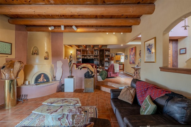 tiled living room featuring beam ceiling and wooden ceiling