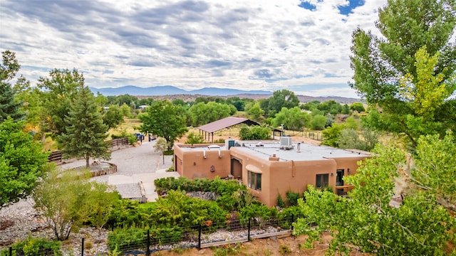 birds eye view of property featuring a mountain view