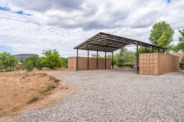 view of parking / parking lot with a carport