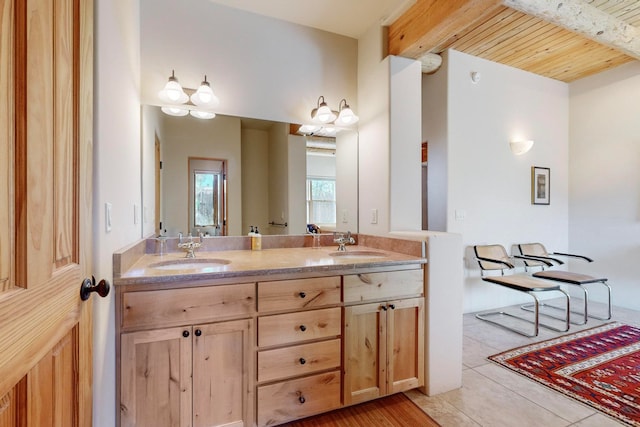 bathroom featuring tile patterned floors, vanity, wooden ceiling, and beamed ceiling