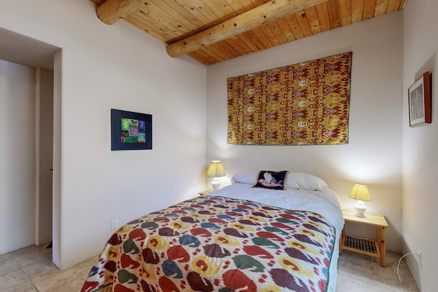 bedroom with beam ceiling and wooden ceiling