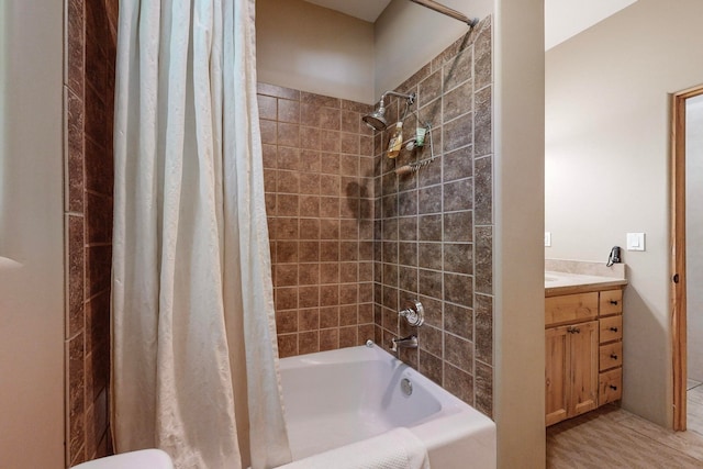 full bathroom featuring shower / bathtub combination with curtain, vanity, and toilet