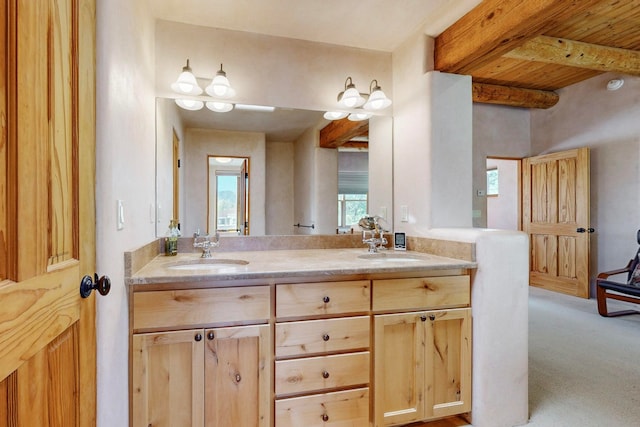 bathroom with beam ceiling, vanity, and wooden ceiling