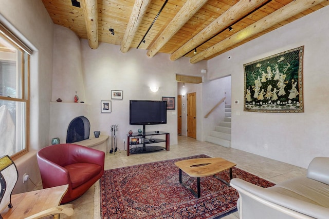 tiled living room with beamed ceiling and wooden ceiling