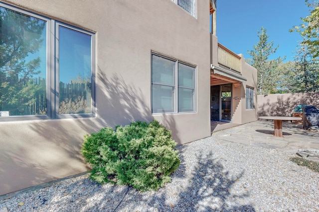 view of side of property featuring a patio