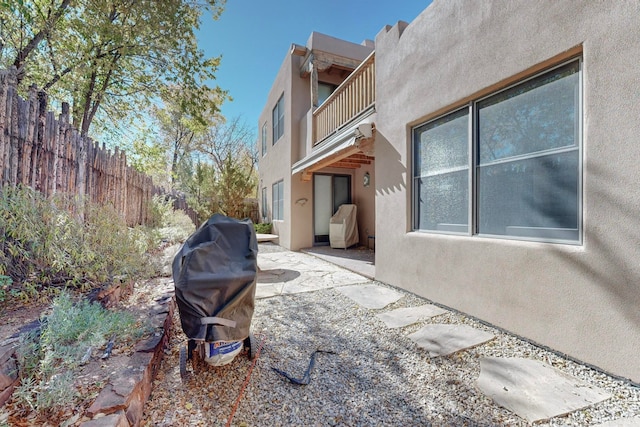 exterior space with a patio and a balcony