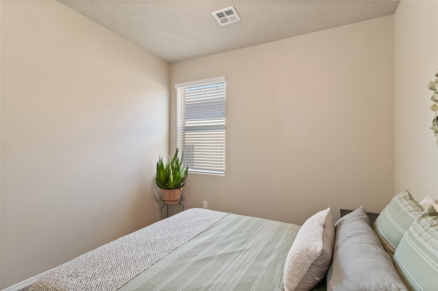 bedroom featuring a textured ceiling