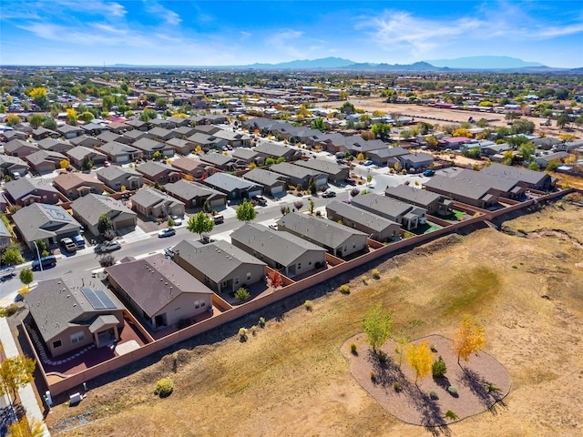 birds eye view of property featuring a mountain view