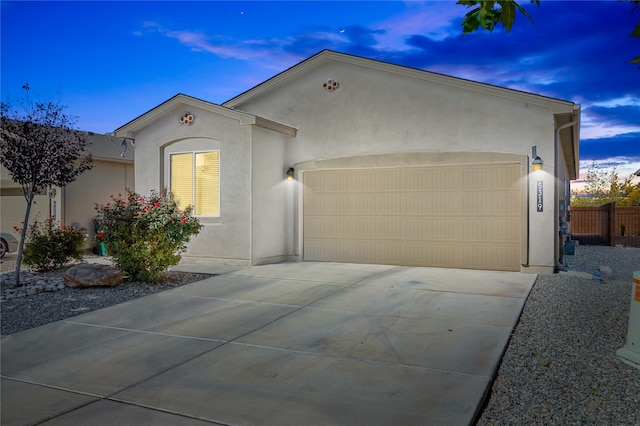 ranch-style home featuring a garage