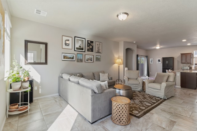 living room featuring a textured ceiling