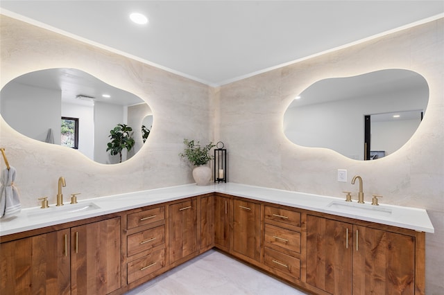 bathroom with vanity, decorative backsplash, and tile walls