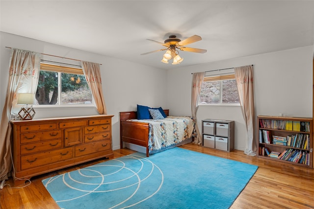 bedroom with hardwood / wood-style flooring and ceiling fan