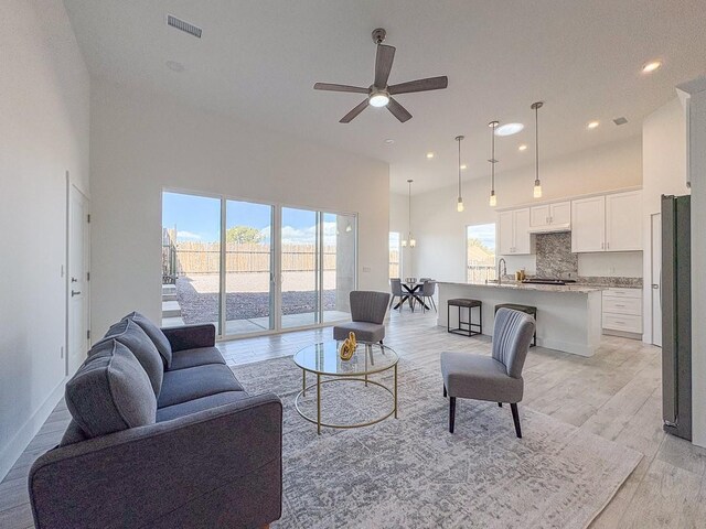 empty room featuring ceiling fan and light hardwood / wood-style flooring