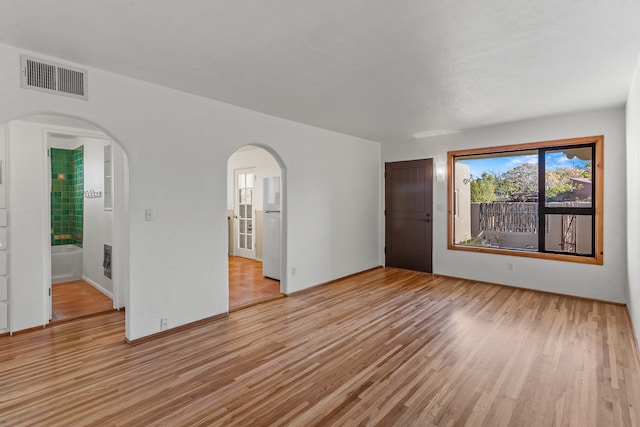 spare room featuring light hardwood / wood-style flooring