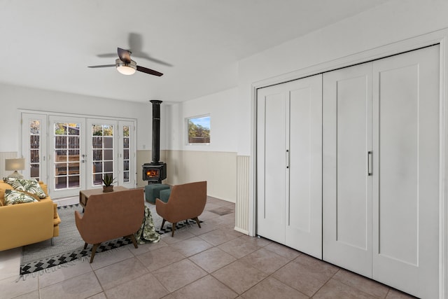 unfurnished room with ceiling fan, light tile patterned flooring, and french doors