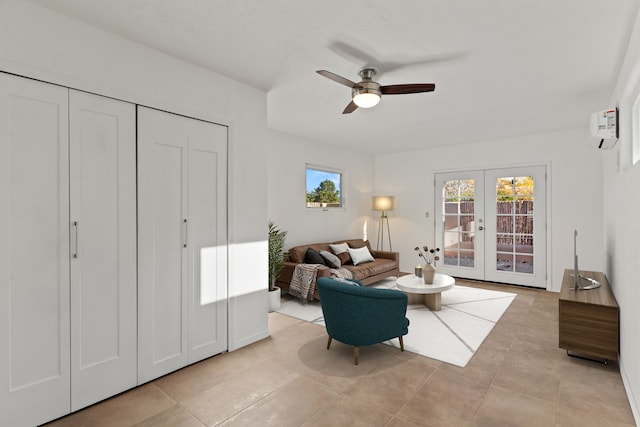 tiled living room with a wall mounted AC, ceiling fan, and french doors