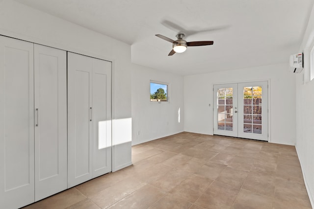 unfurnished bedroom with ceiling fan, french doors, light tile patterned flooring, and a wall mounted air conditioner