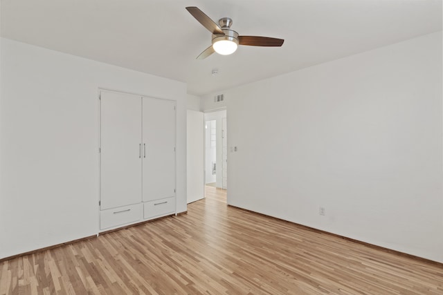 unfurnished bedroom with a closet, ceiling fan, and light hardwood / wood-style flooring