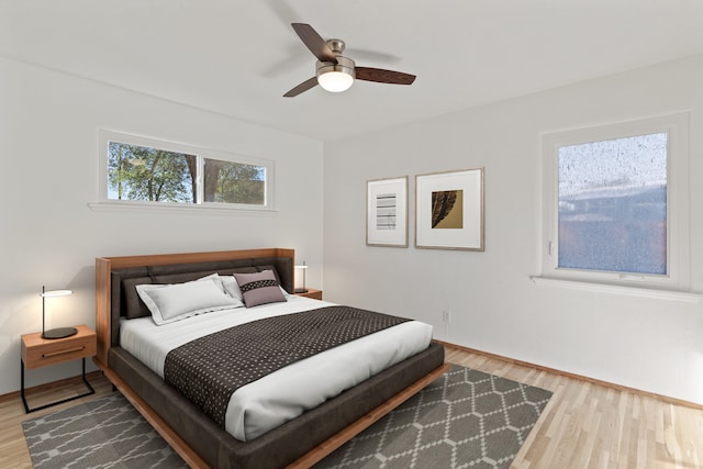 bedroom featuring ceiling fan and wood-type flooring