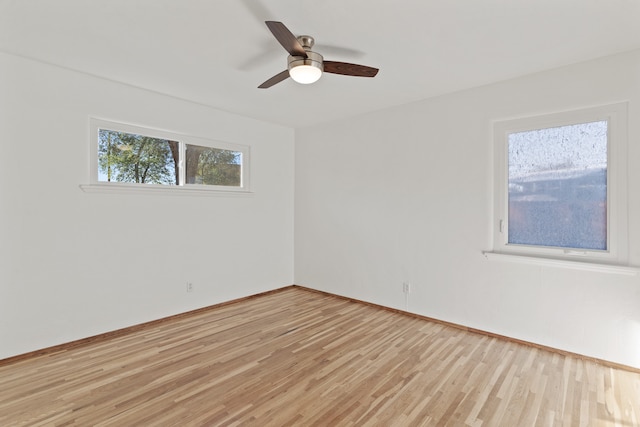 unfurnished room featuring ceiling fan and light wood-type flooring