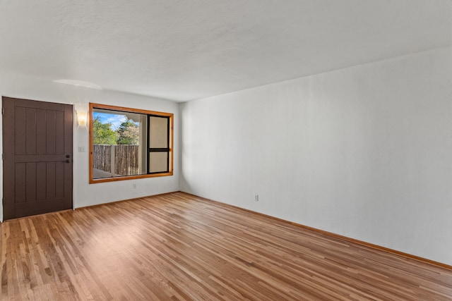 unfurnished room featuring light hardwood / wood-style flooring