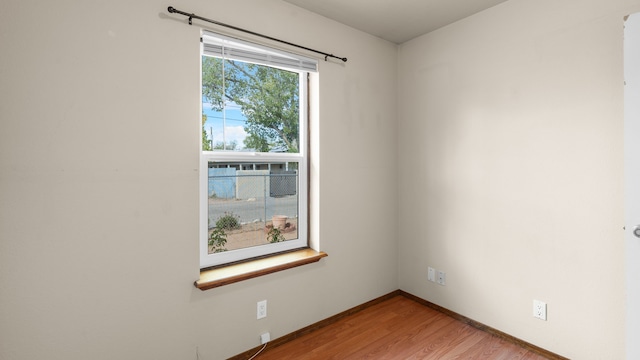 spare room featuring light wood-type flooring