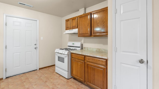 kitchen with white gas stove