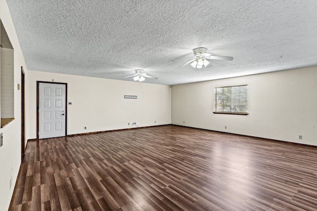 empty room featuring dark hardwood / wood-style flooring