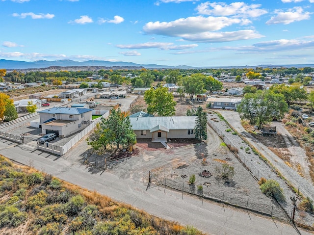 birds eye view of property with a mountain view