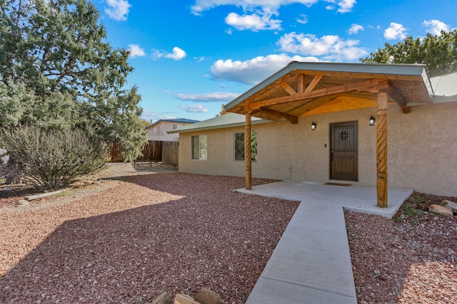 doorway to property featuring a patio area