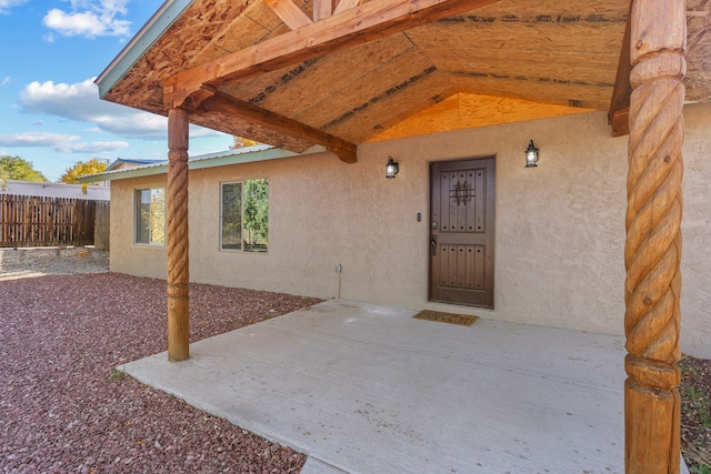 entrance to property with a patio area