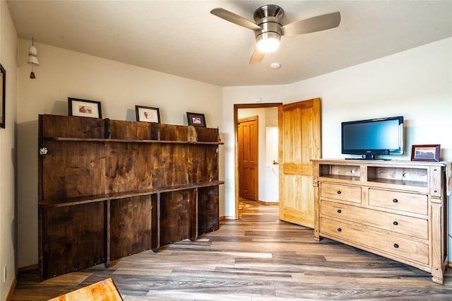 bedroom featuring hardwood / wood-style floors and ceiling fan