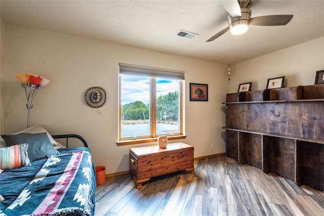 bedroom featuring hardwood / wood-style flooring and ceiling fan