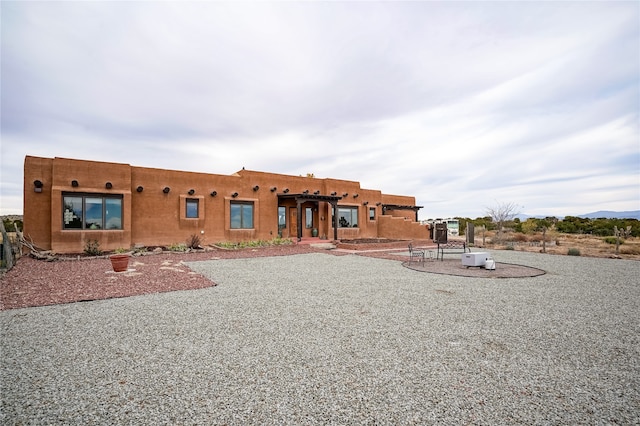 back of property with a patio area