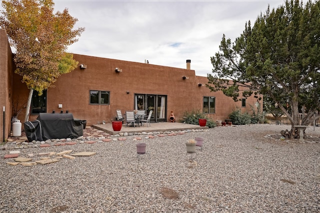 rear view of property with a patio