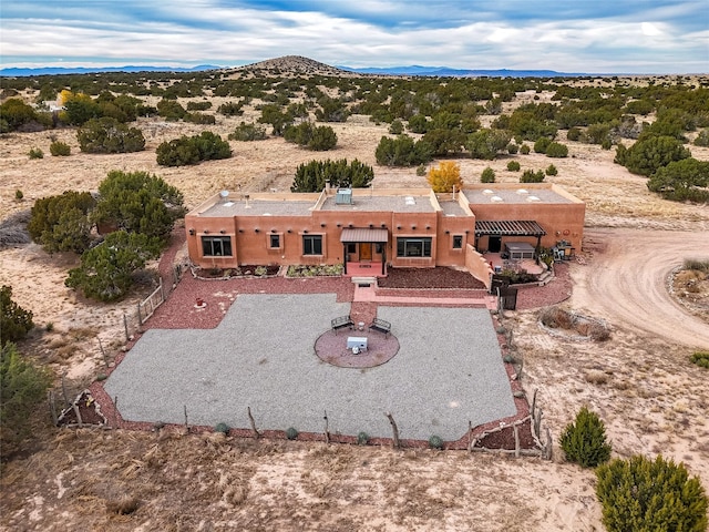 birds eye view of property with a mountain view