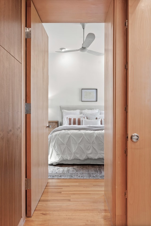 bedroom featuring ceiling fan and light hardwood / wood-style flooring