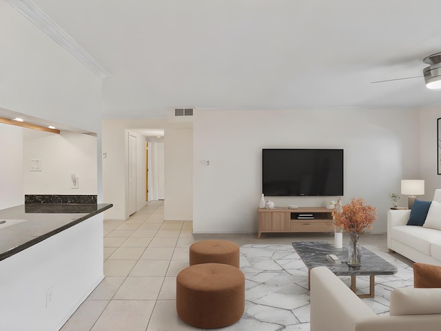 505 Oppenheimer Dr Unit 511, Los Alamos, NM 87544 - living area with light tile patterned floors, crown molding, ceiling fan, and baseboards