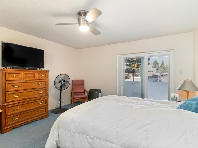 bedroom featuring access to exterior, a ceiling fan, and dark colored carpet