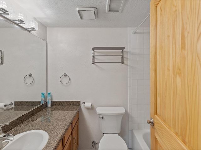505 Oppenheimer Dr Unit 511, Los Alamos, NM 87544 - bathroom with a textured ceiling, toilet, vanity, and washtub / shower combination