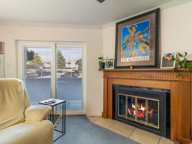 sitting room featuring carpet, ornamental molding, a fireplace, and tile patterned flooring