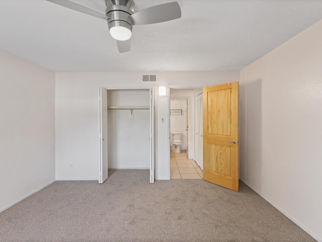 505 Oppenheimer Dr Unit 511, Los Alamos, NM 87544 - unfurnished bedroom with light colored carpet, a closet, ceiling fan, and baseboards