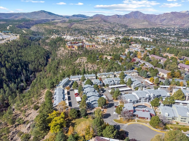 drone / aerial view featuring a residential view and a mountain view