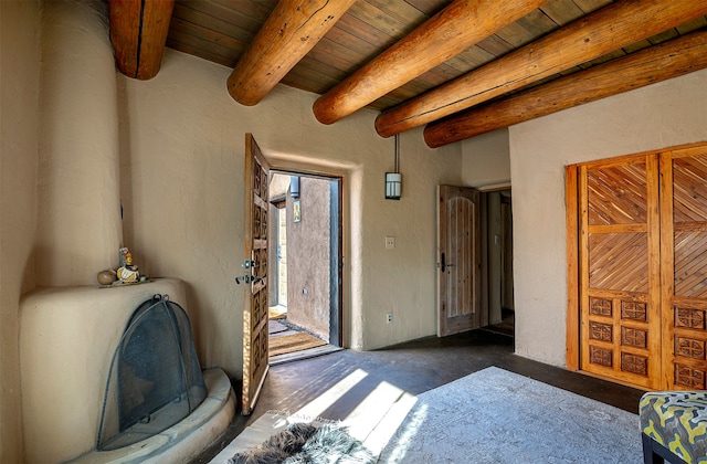 interior space featuring beam ceiling and wood ceiling