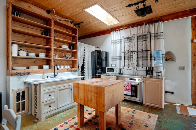 kitchen with a skylight, sink, wooden ceiling, a kitchen island, and butcher block counters