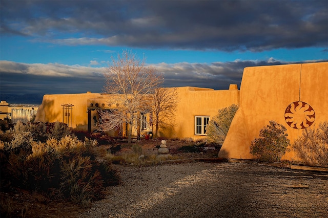 view of property exterior at dusk