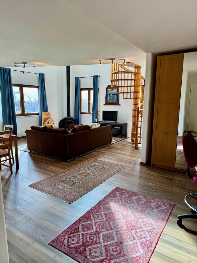 living area with hardwood / wood-style flooring