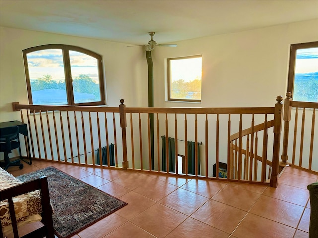 interior space with tile patterned flooring and an upstairs landing