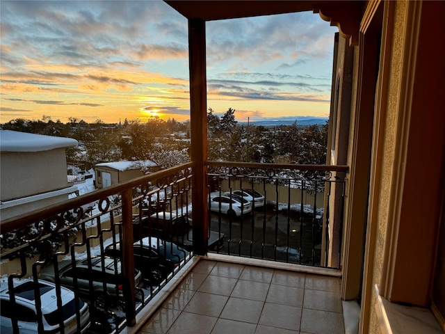 view of balcony at dusk