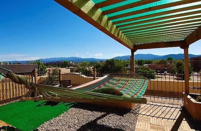 view of jungle gym with a mountain view and a pergola